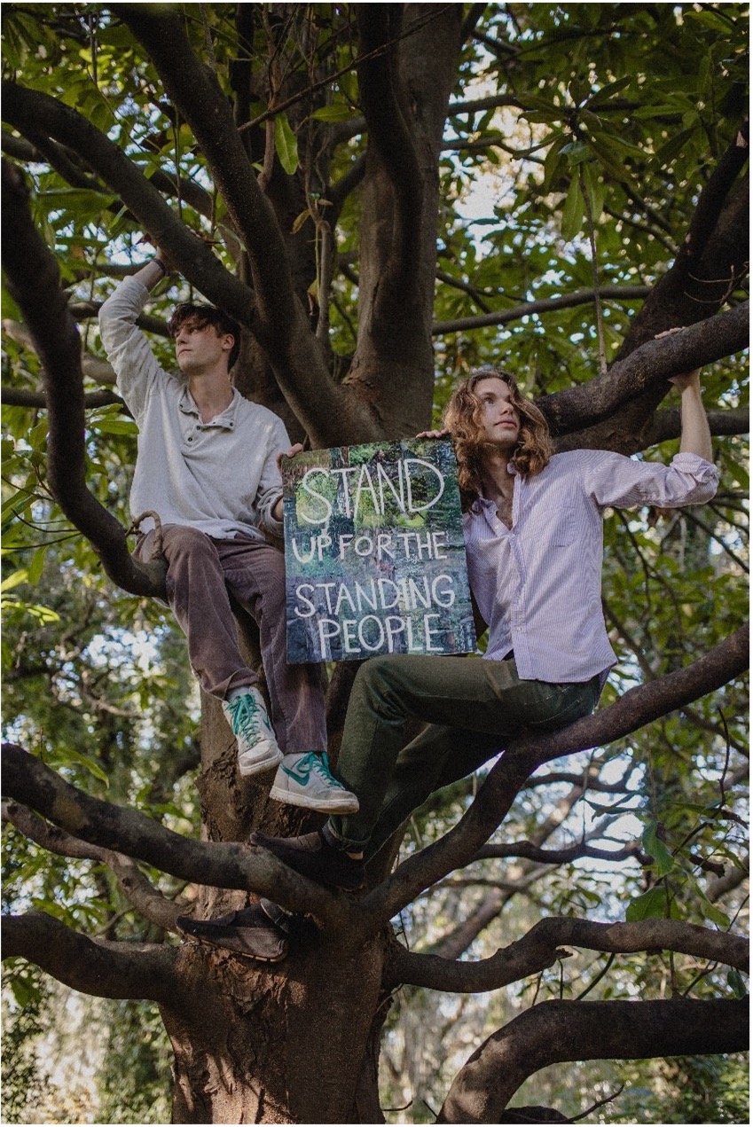 Belvin Olasov (right) of the Charleston Climate Coalition (CCC) up a tree with former CCC project manager Rowan Emerson. Photo courtesy of CCC.